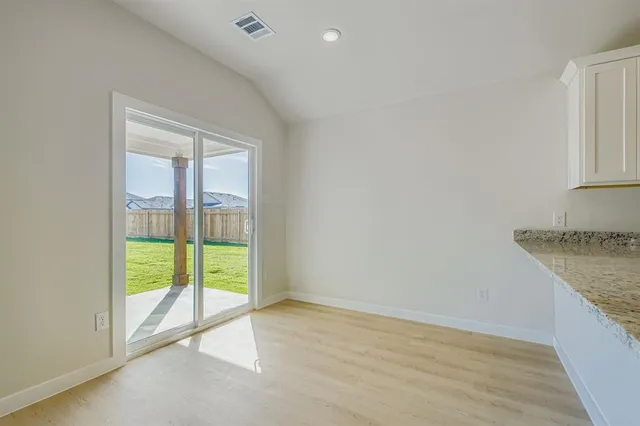 a view of an empty room and window
