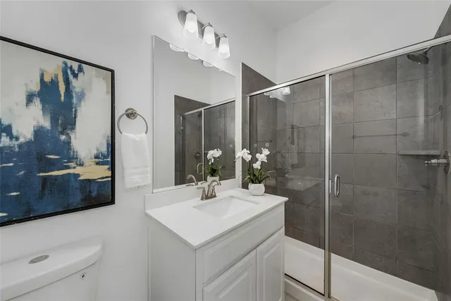 a bed room with bed and a chandelier