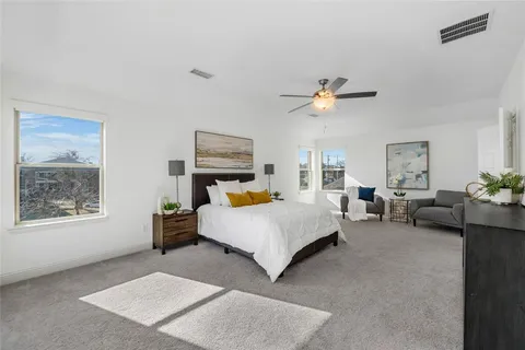 a bedroom with furniture and a window