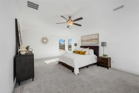 a living room with furniture and white walls