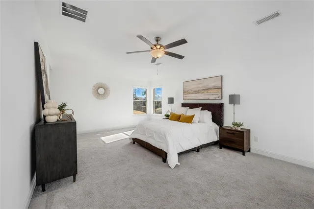 a living room with furniture and white walls