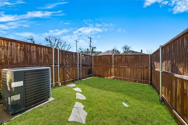 an aerial view of a city with streets and houses