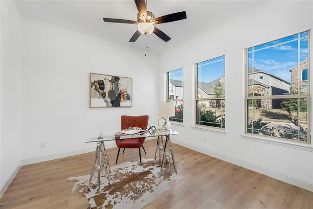 a work room with furniture and a window