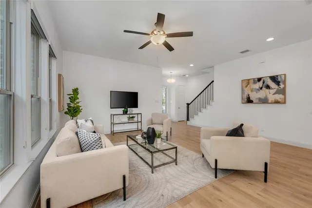 a view of a dining room with furniture window and wooden floor