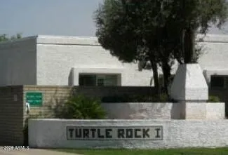 a view of house with a yard