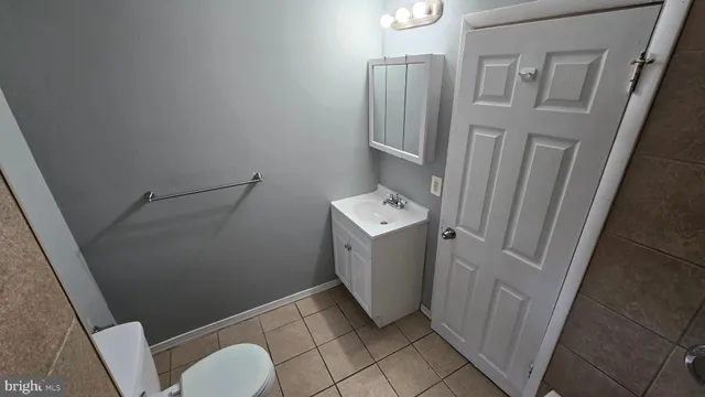 a bathroom with a shower and a sink