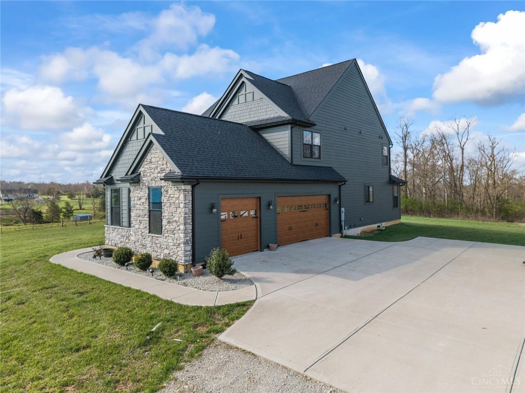 2425 Middleboro Road Clarksville, OH 45113 - Photo 19 of 91 This newly built home features a striking combination of stone and siding with a spacious driveway.