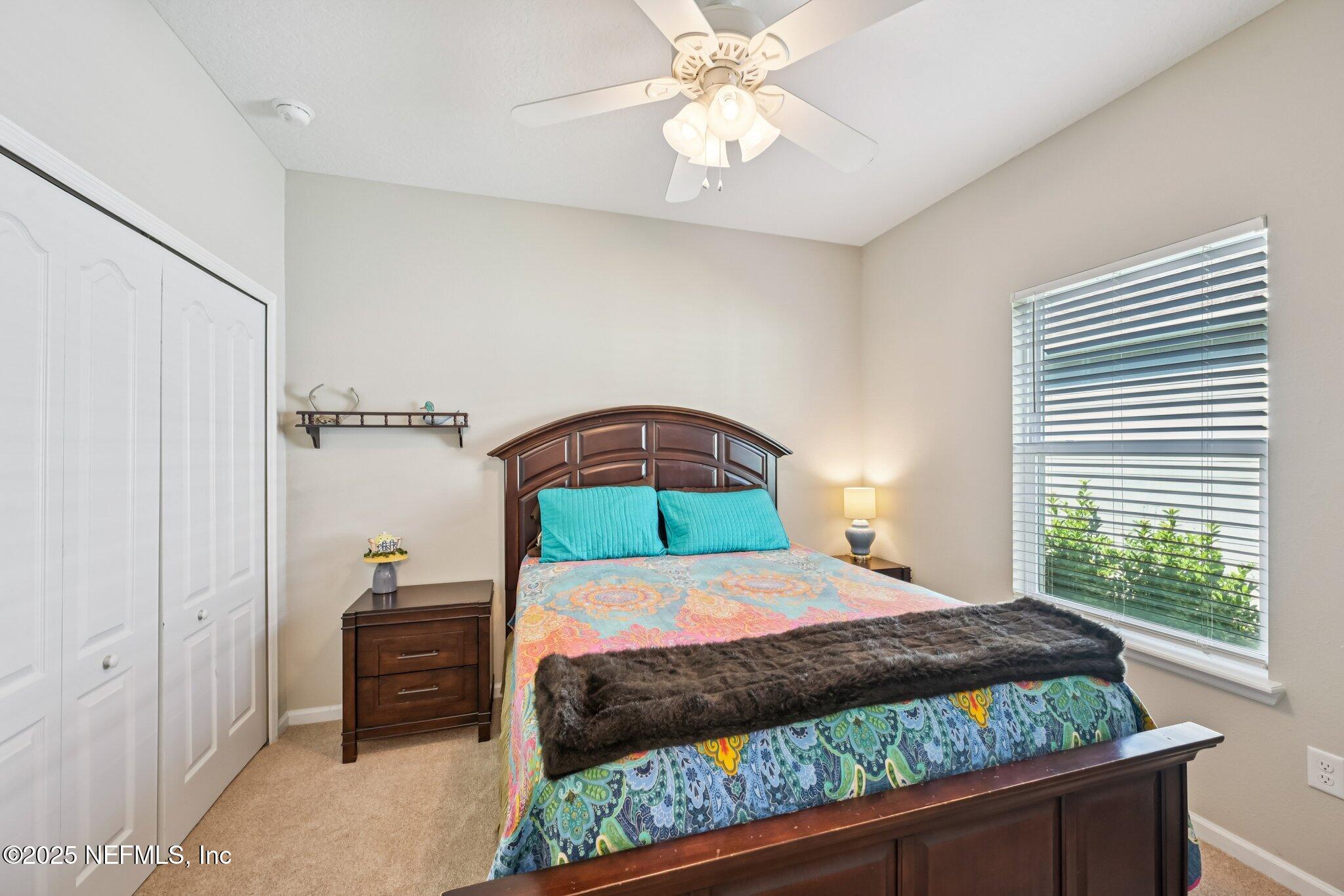 60 Cloverly Point St. Augustine, FL 32092 - Photo 12 of 44 a bedroom with a bed and a window