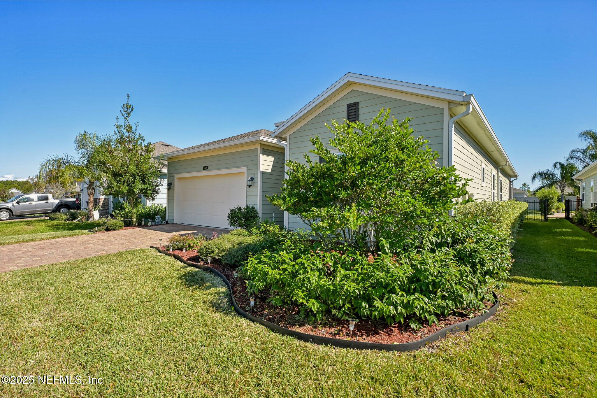 60 Cloverly Point St. Augustine, FL 32092 - Photo 2 of 44 a front view of a house with garden