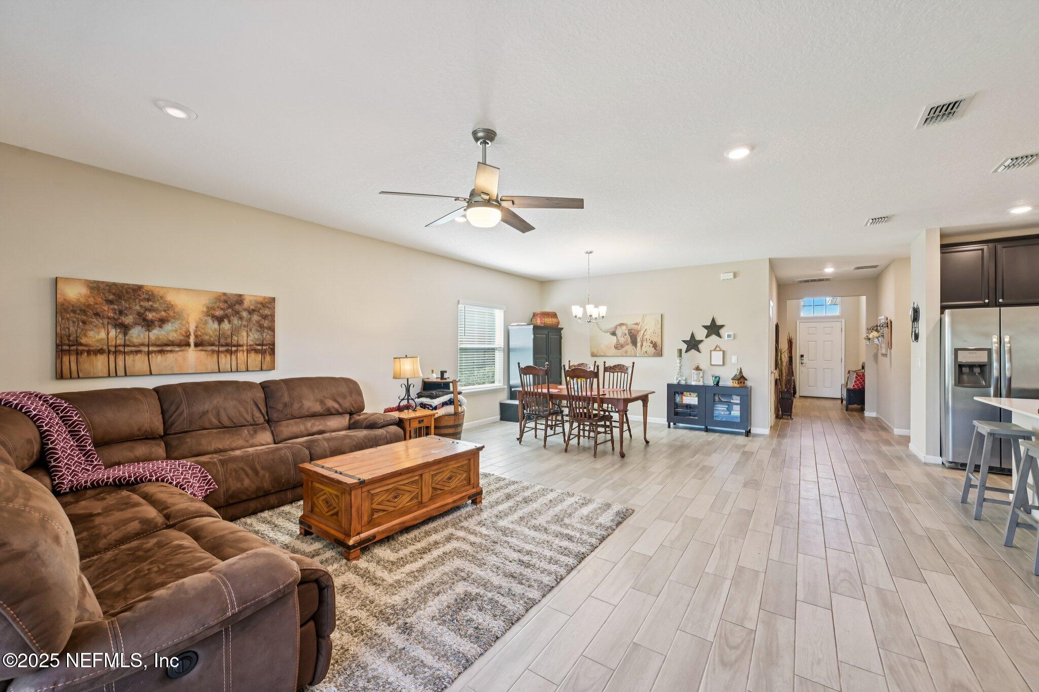 60 Cloverly Point St. Augustine, FL 32092 - Photo 23 of 44 a living room with furniture and wooden floor
