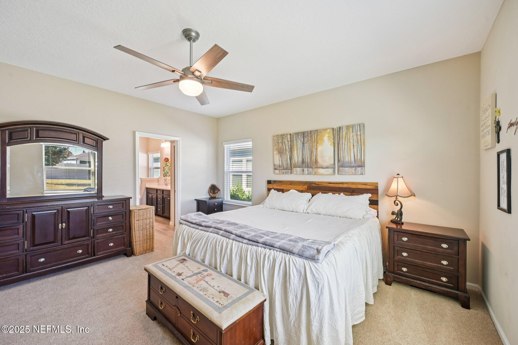 60 Cloverly Point St. Augustine, FL 32092 - Photo 28 of 44 a bedroom with a bed and a dresser