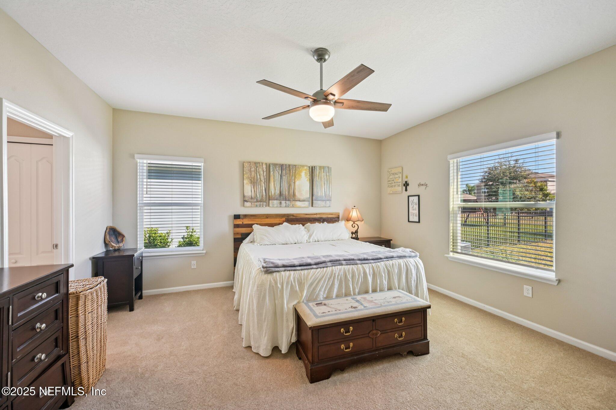 60 Cloverly Point St. Augustine, FL 32092 - Photo 29 of 44 a bedroom with a bed dresser and a window