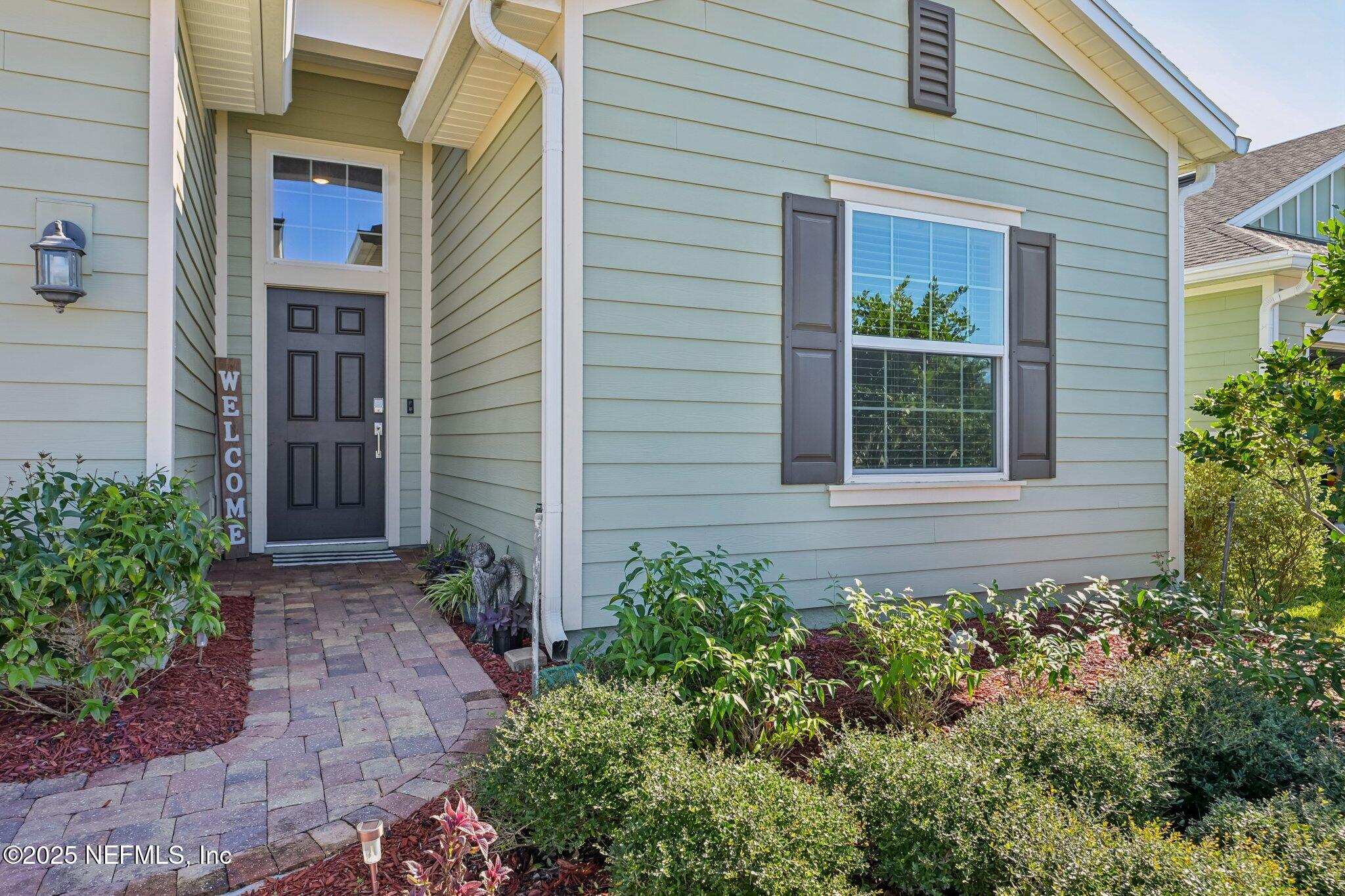 60 Cloverly Point St. Augustine, FL 32092 - Photo 3 of 44 a view of a house with potted plants