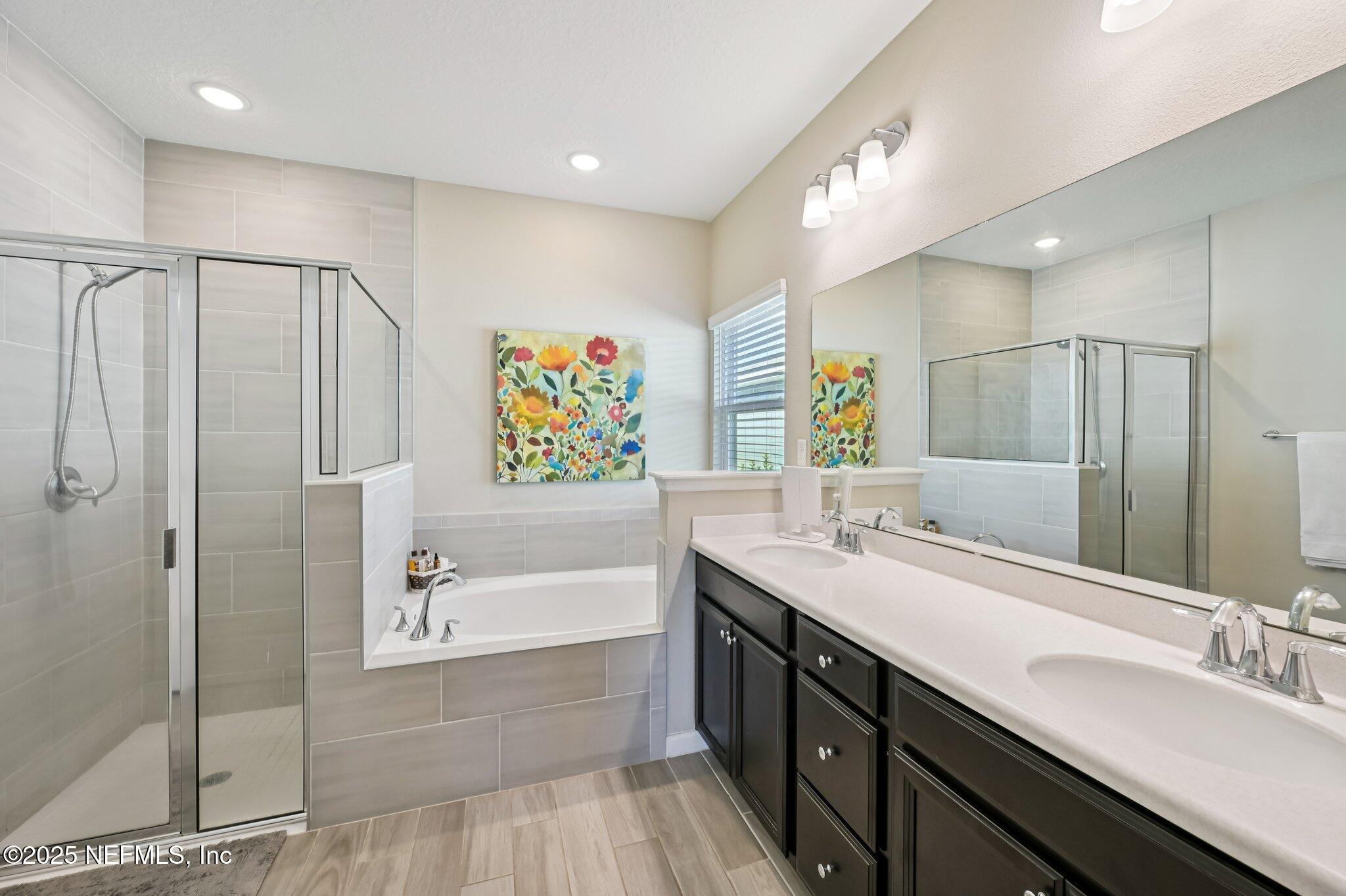 60 Cloverly Point St. Augustine, FL 32092 - Photo 32 of 44 a bathroom with a double vanity sink mirror and shower