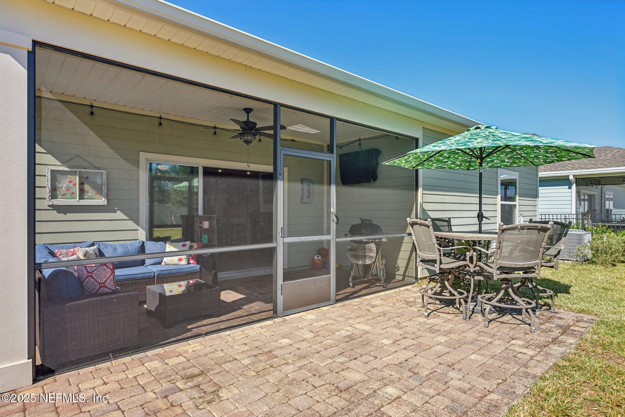 60 Cloverly Point St. Augustine, FL 32092 - Photo 33 of 44 a patio with table and chairs