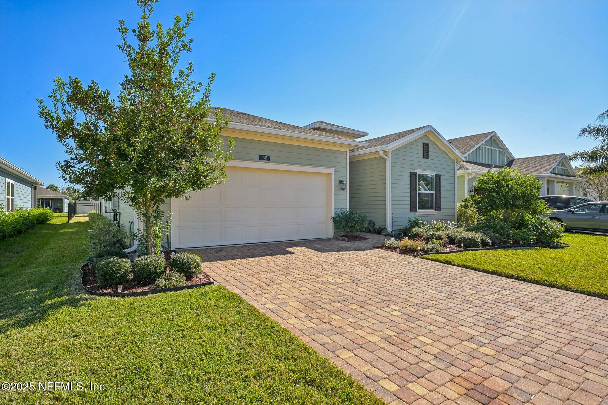 60 Cloverly Point St. Augustine, FL 32092 - Photo 35 of 44 a front view of a house with garden