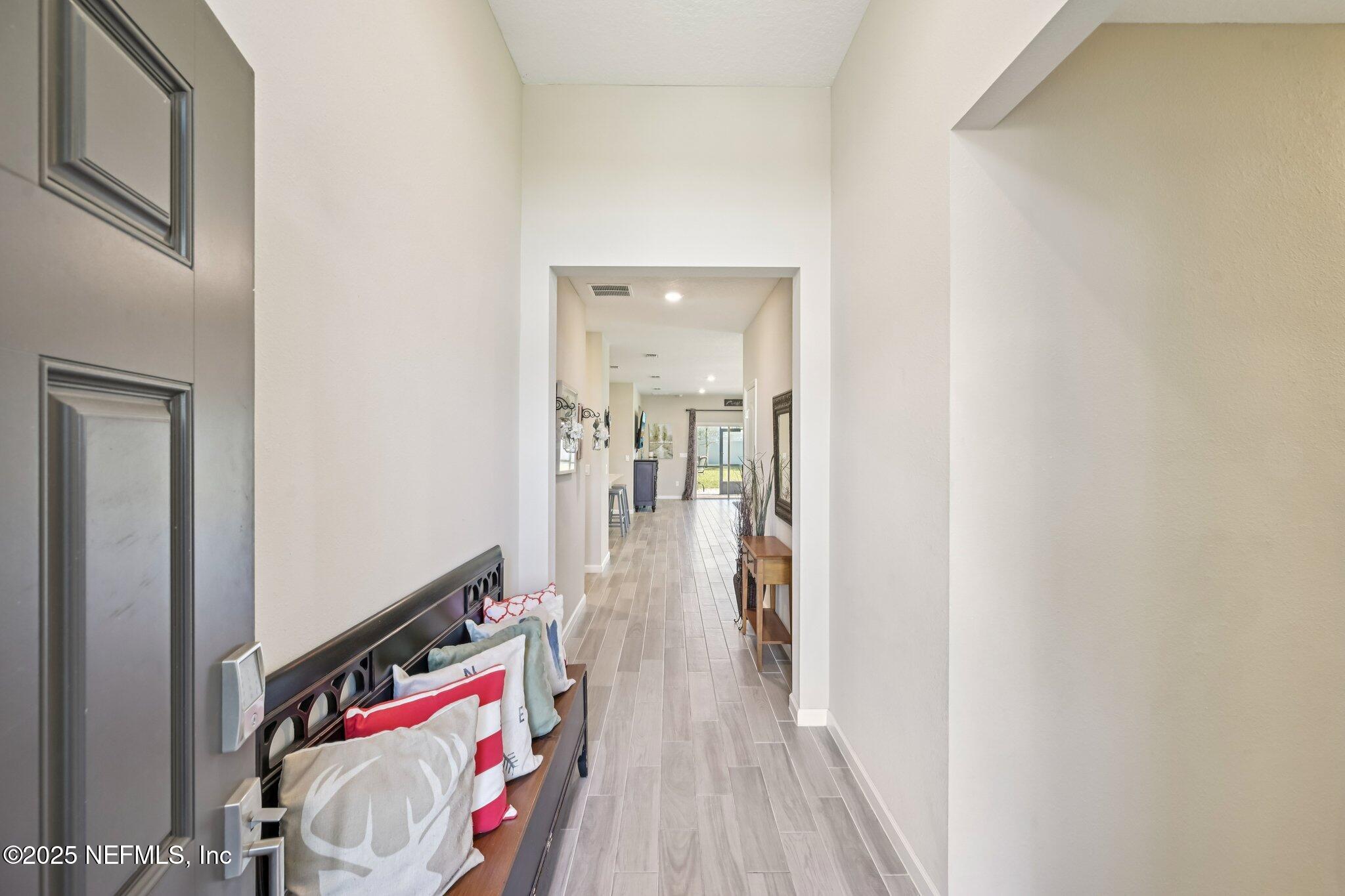 60 Cloverly Point St. Augustine, FL 32092 - Photo 5 of 44 a view of a hallway view with wooden floor and closet