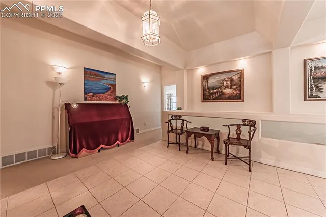 a bedroom with furniture and a chandelier