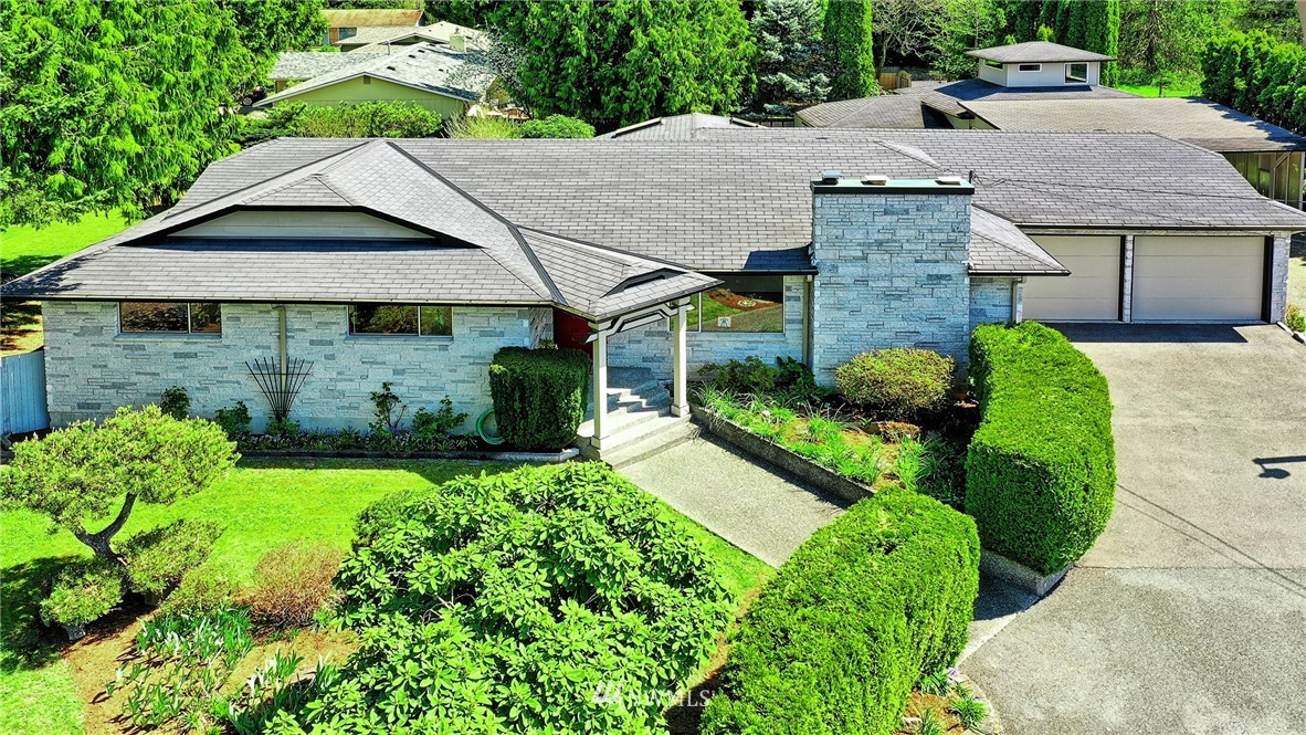 18611 North Road Bothell, WA 98012 - Photo 2 of 38 a aerial view of a house with a yard plants and large tree