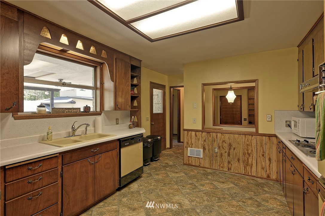 18611 North Road Bothell, WA 98012 - Photo 12 of 38 a spacious bathroom with a double vanity sink and a mirror