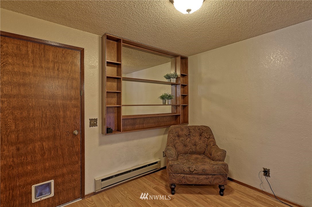 18611 North Road Bothell, WA 98012 - Photo 19 of 38 a bedroom with a bed and a dresser