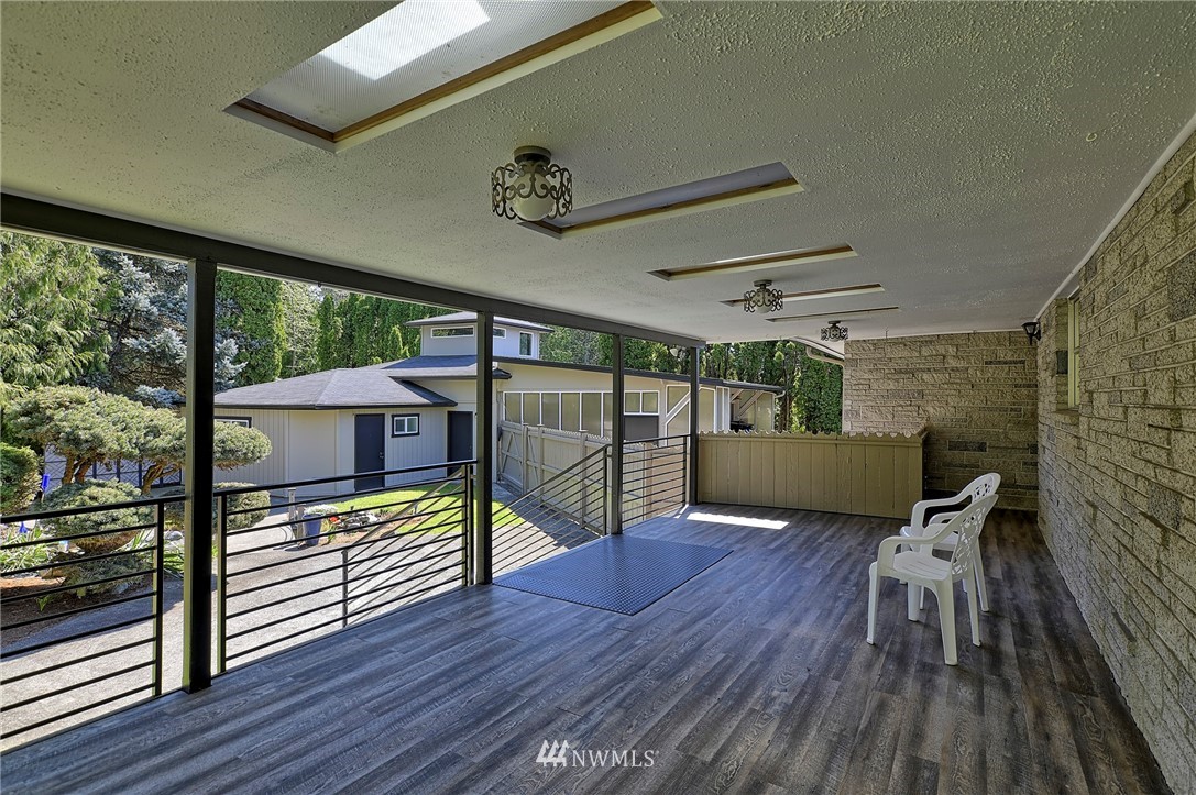 18611 North Road Bothell, WA 98012 - Photo 25 of 38 a view of a porch with wooden floor