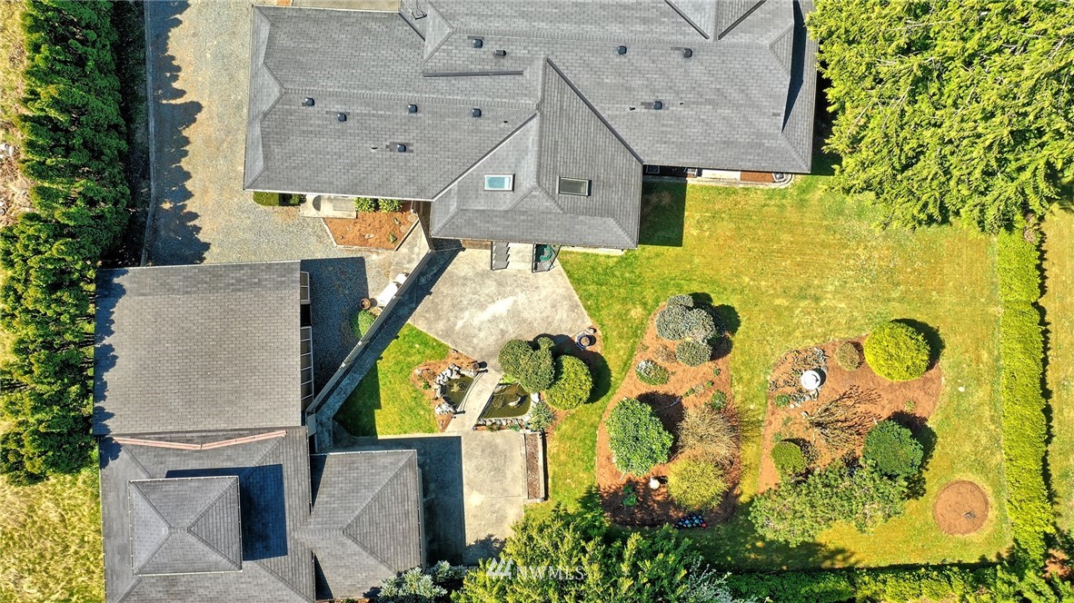 18611 North Road Bothell, WA 98012 - Photo 38 of 38 aerial view of a house with swimming pool and large trees