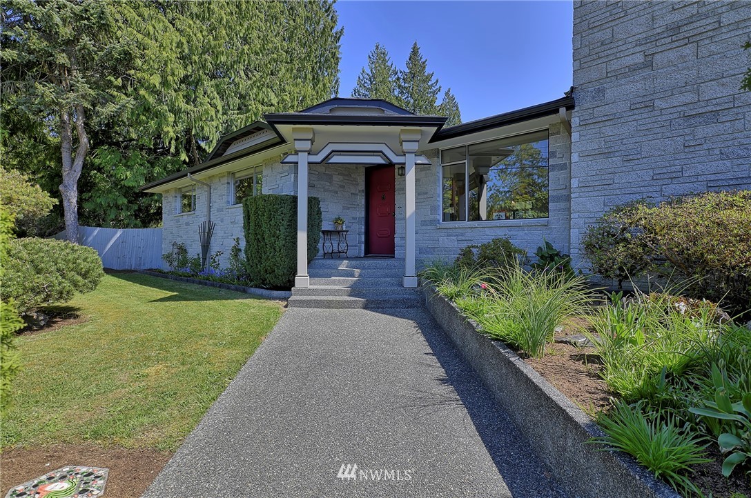 18611 North Road Bothell, WA 98012 - Photo 5 of 38 a front view of a house with a yard