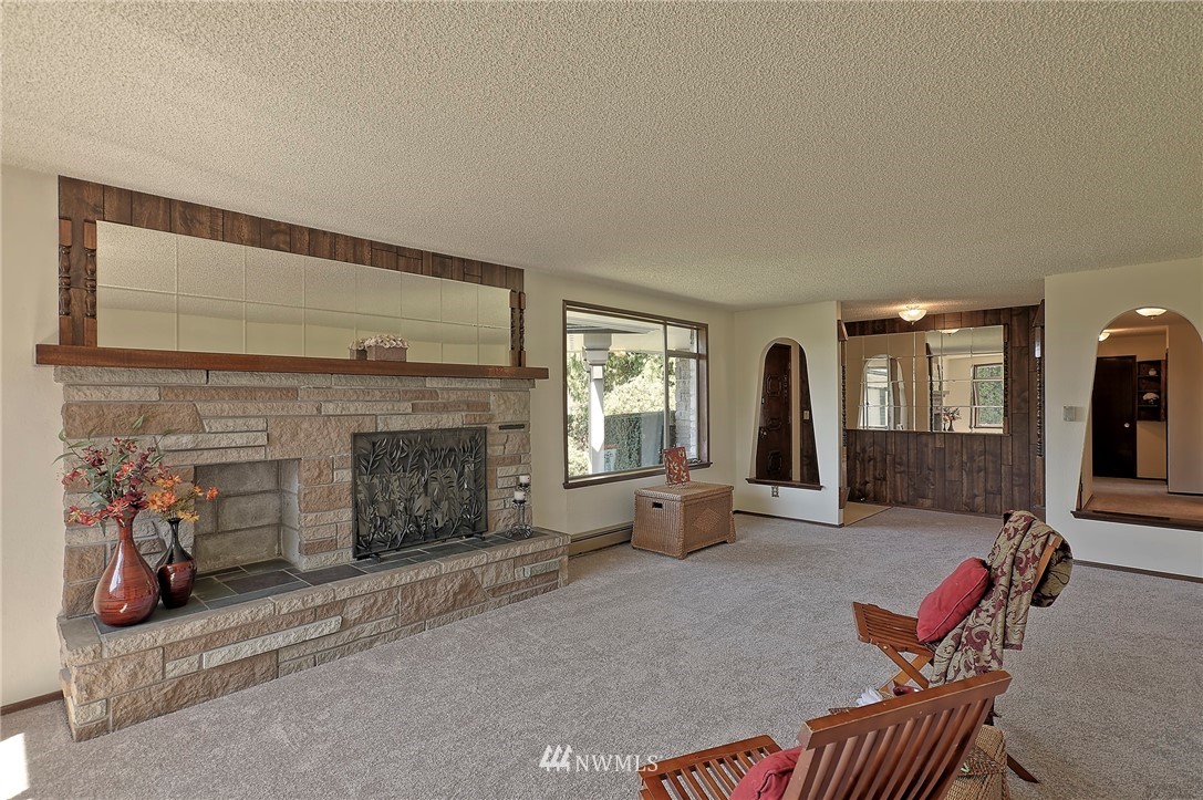 18611 North Road Bothell, WA 98012 - Photo 8 of 38 a living room with furniture and a fireplace