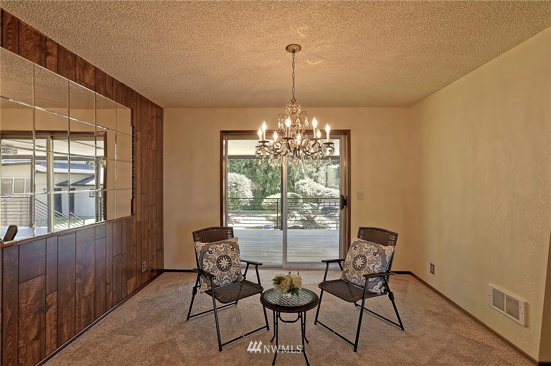 18611 North Road Bothell, WA 98012 - Photo 9 of 38 a view of a dining room with furniture window and outside view