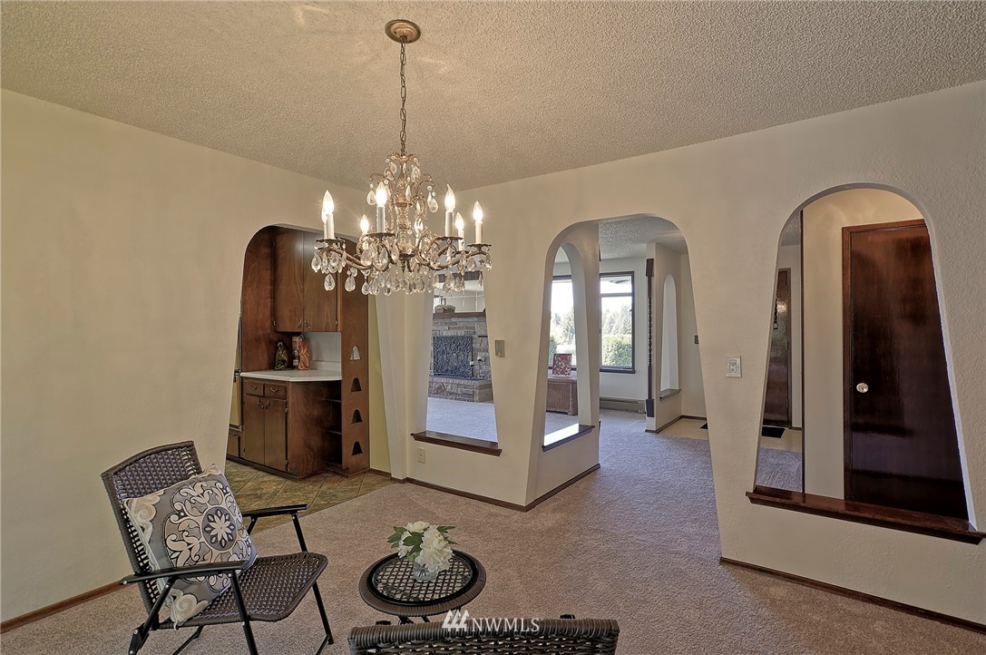 18611 North Road Bothell, WA 98012 - Photo 10 of 38 a view of a room with furniture and chandelier
