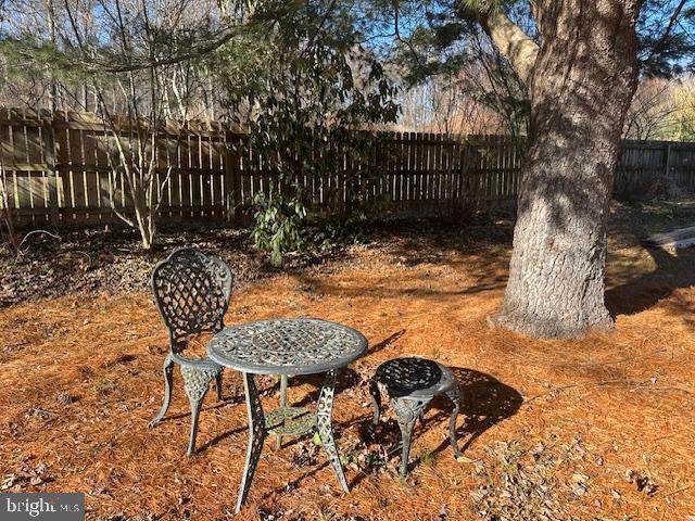 1290 Golf Course Road Birdsboro, PA 19508 - Photo 33 of 35 a view of backyard with table and chairs and wooden fence