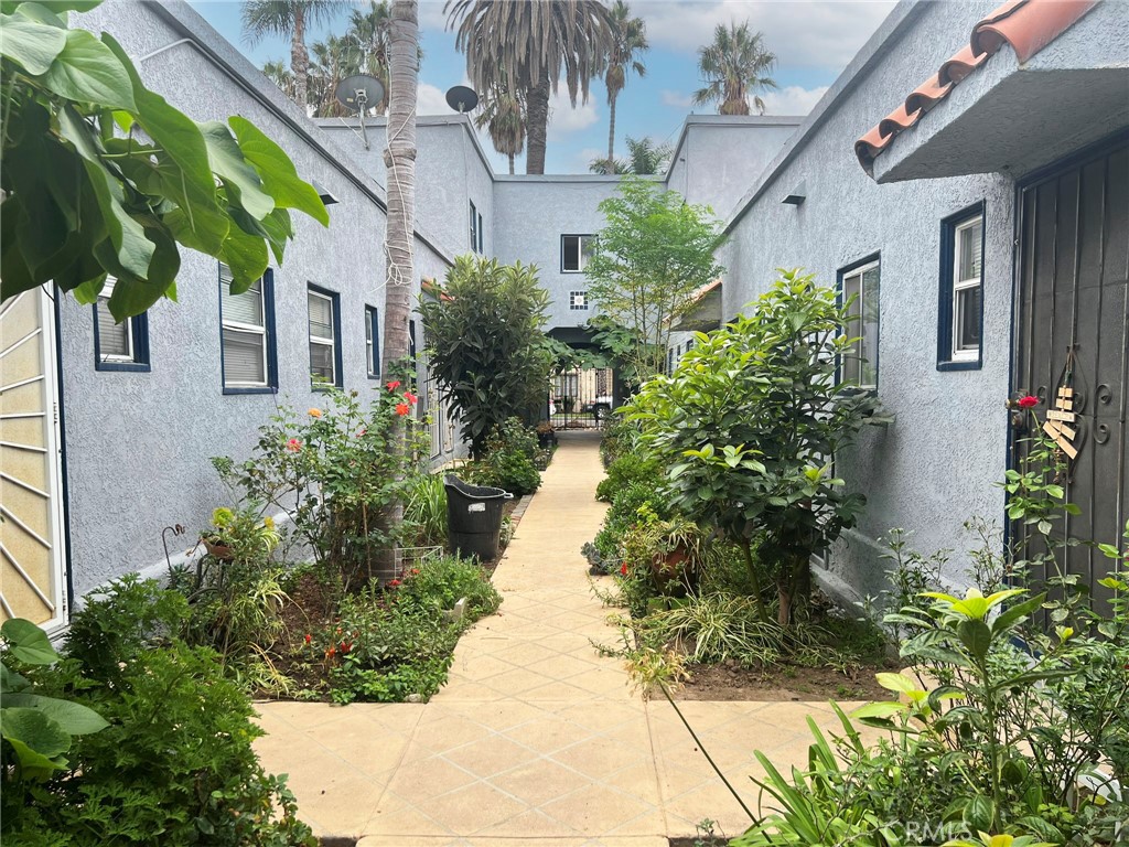 1135 East 3rd Street Long Beach, CA 90802 - Photo 15 of 16 a view of a pathway with flower plants