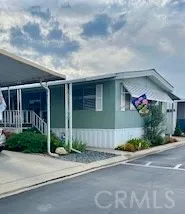 a front view of a house with a yard and a garage