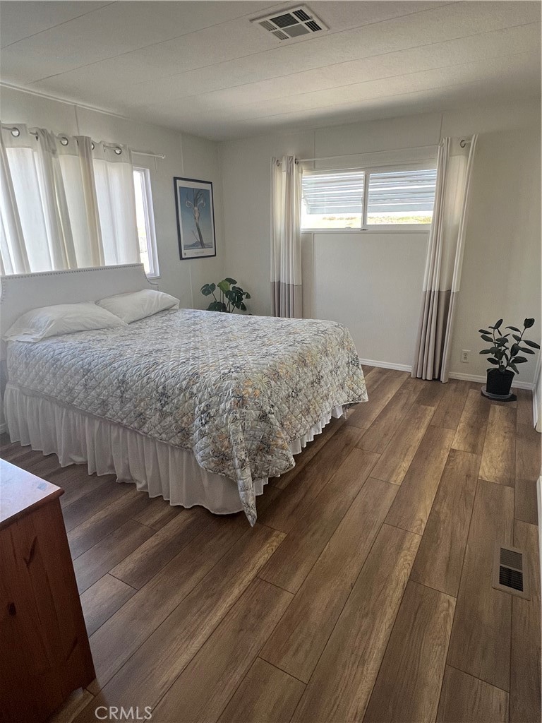 20600 South Main Street, Unit 23 Carson, CA 90745 - Photo 11 of 18 a bedroom with a bed and a dresser