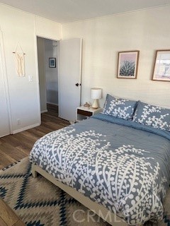 20600 South Main Street, Unit 23 Carson, CA 90745 - Photo 12 of 18 a bedroom with bed and cabinets