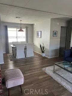 a view of a living room and dining room