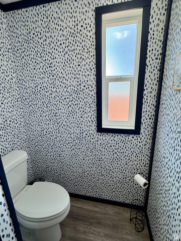 972 Ridgeway Loop, Unit 228 Garden City, UT 84028 - Photo 13 of 26 Master bath featuring dark wood-style floors and toilet