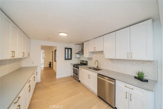 a kitchen with cabinets and appliances