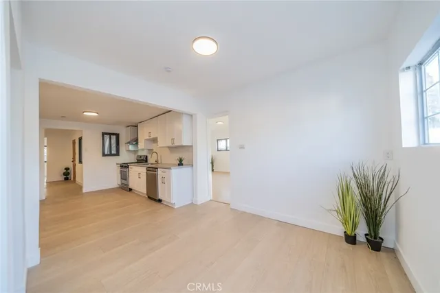 a view of a kitchen with a sink and a window