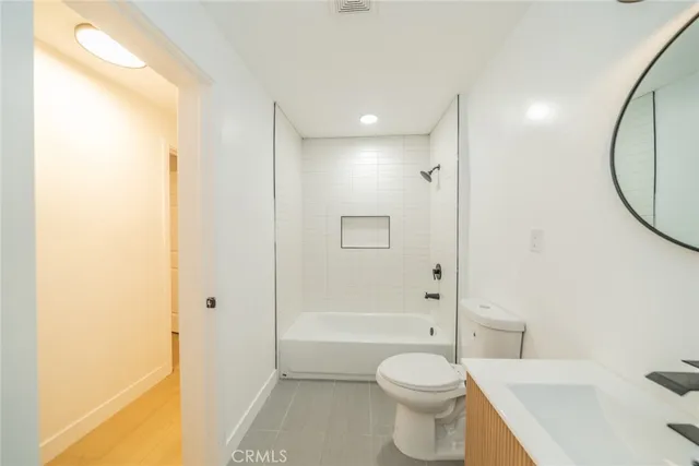 a bathroom with a toilet a sink and a bathtub
