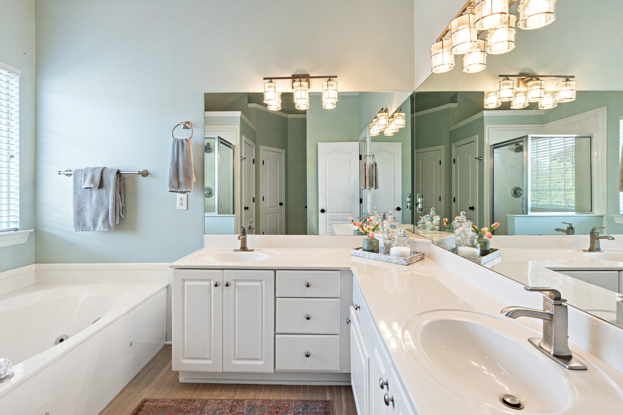 3156 Vera Valley Road Franklin, TN 37064 - Photo 14 of 44 a spacious bathroom with a sink a large mirror and a bathtub with shower