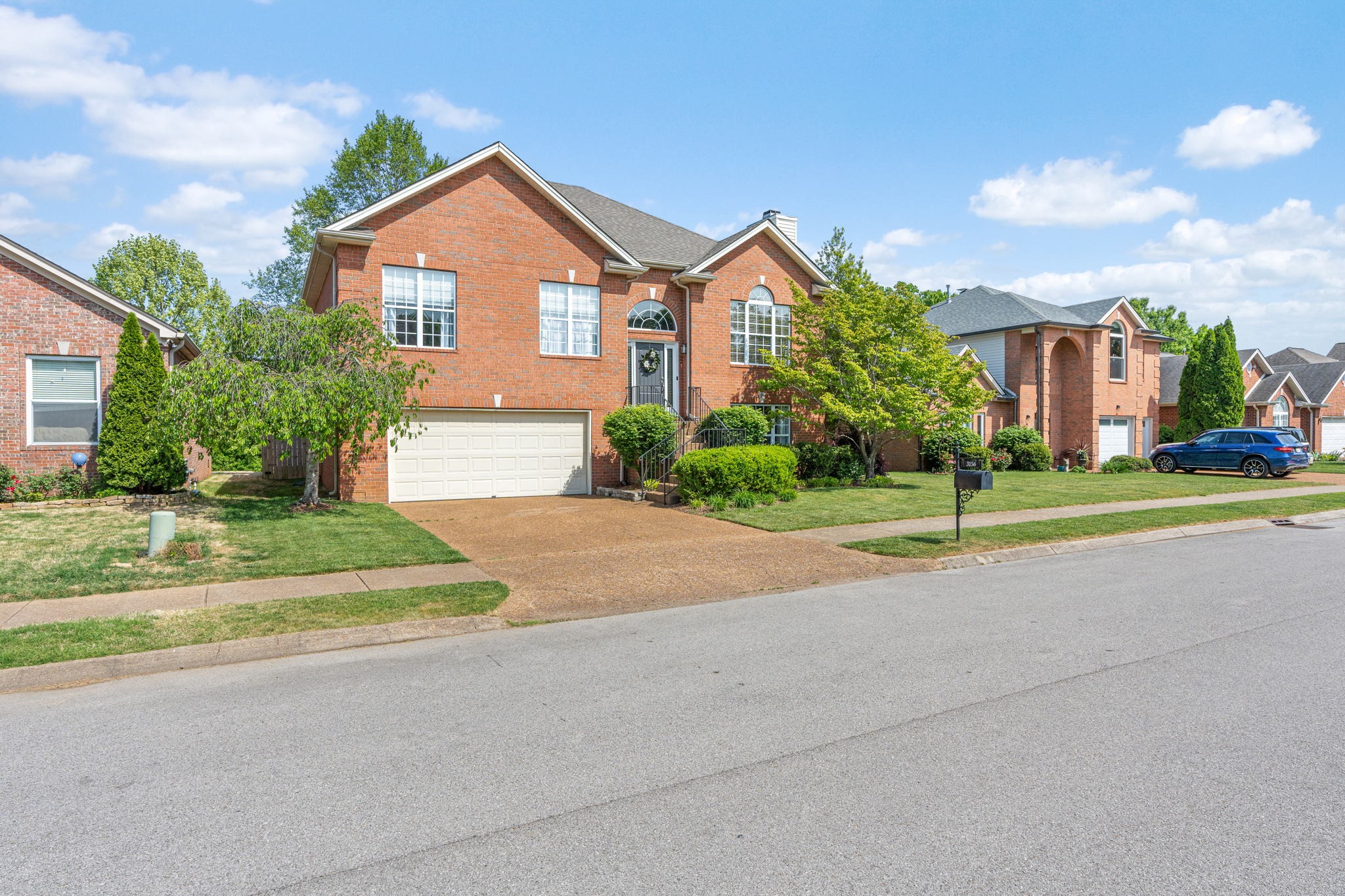 3156 Vera Valley Road Franklin, TN 37064 - Photo 2 of 44 a front view of a house with a yard and garage