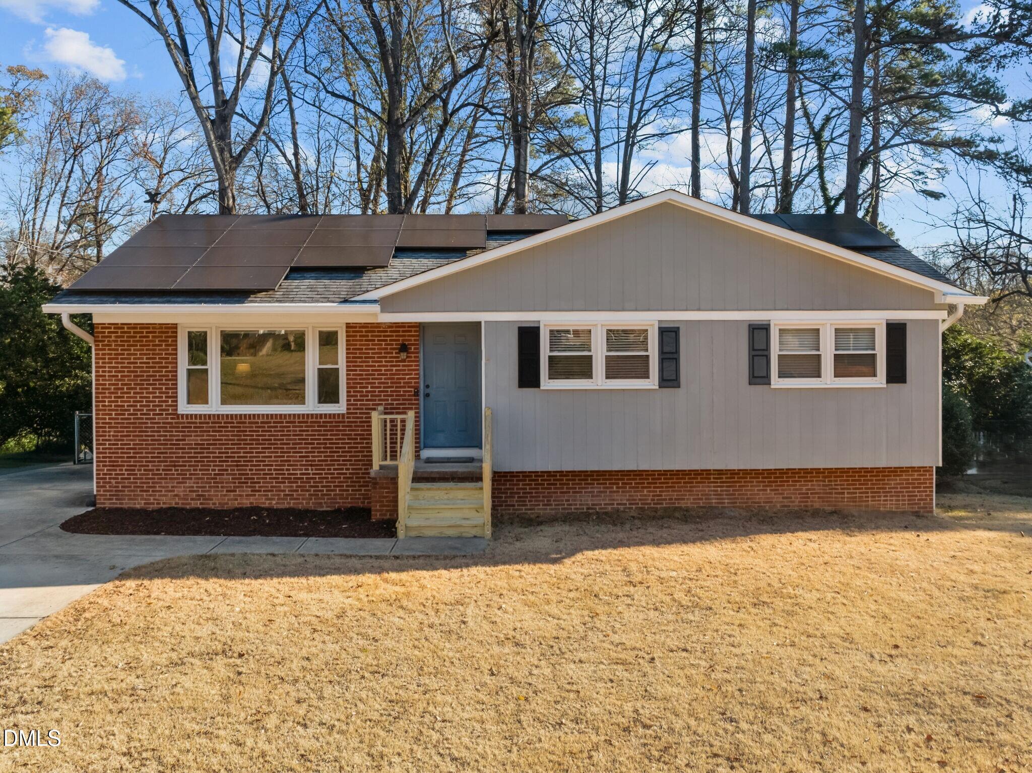4828 Latimer Road Raleigh, NC 27609 - Photo 1 of 47 a front view of a house with a yard