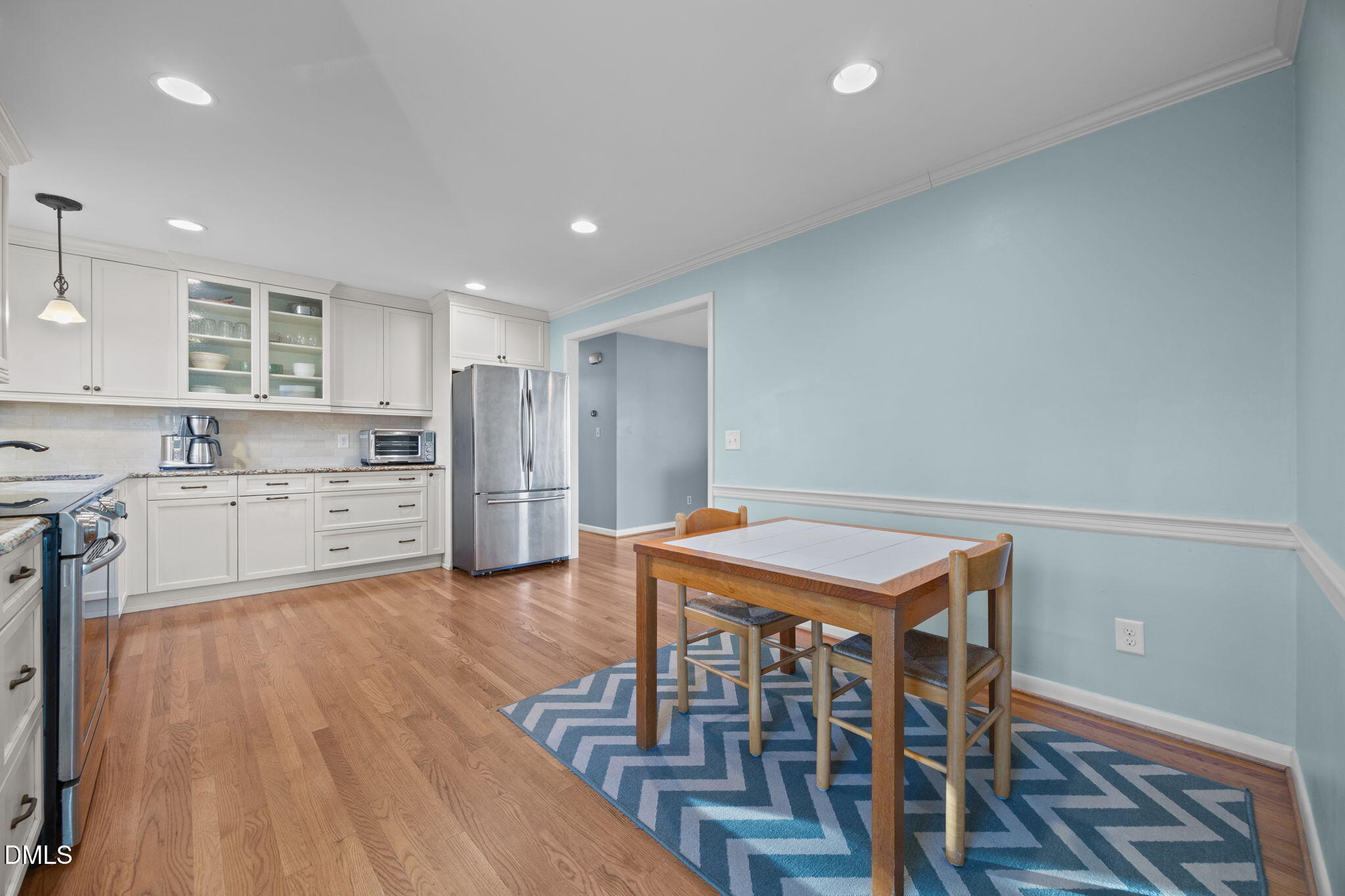 4828 Latimer Road Raleigh, NC 27609 - Photo 11 of 47 a kitchen that has a table and chairs in it