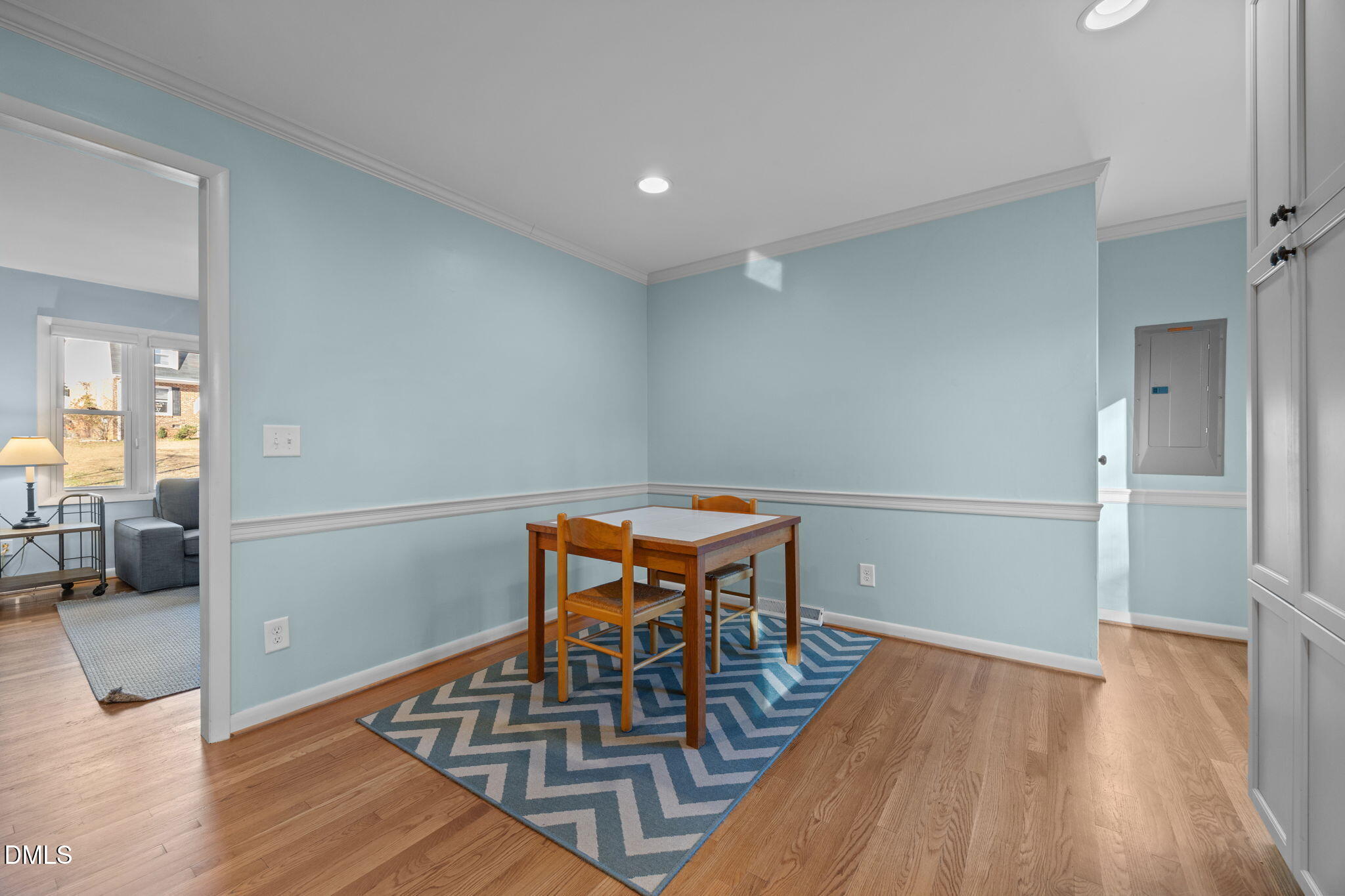 4828 Latimer Road Raleigh, NC 27609 - Photo 12 of 47 a view of a dining room with furniture and wooden floor