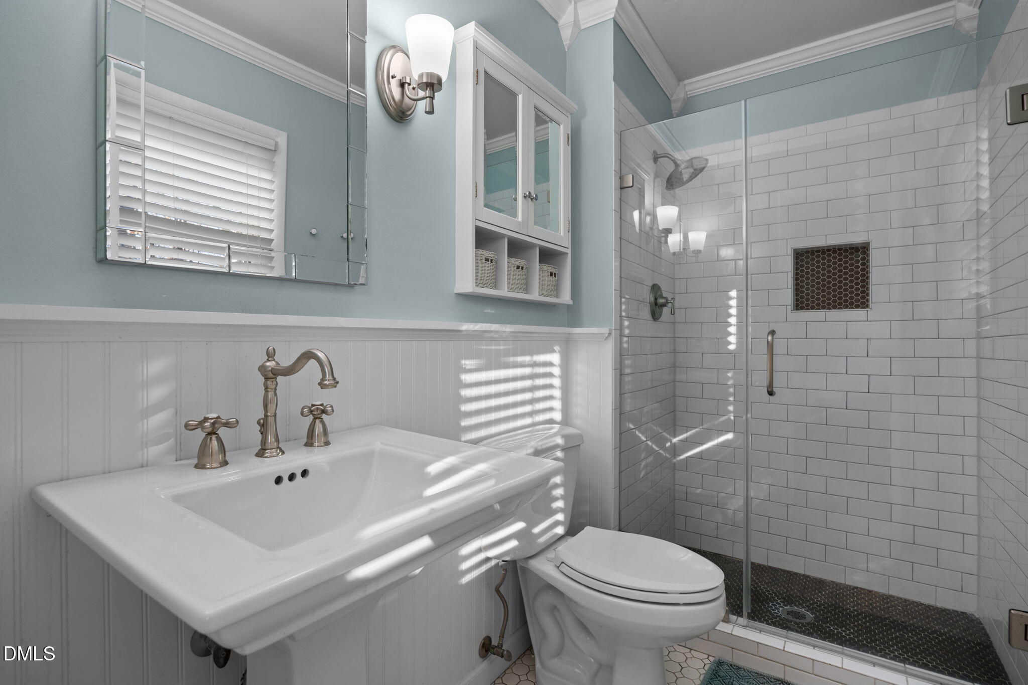 4828 Latimer Road Raleigh, NC 27609 - Photo 15 of 47 a bathroom with a sink a toilet and shower