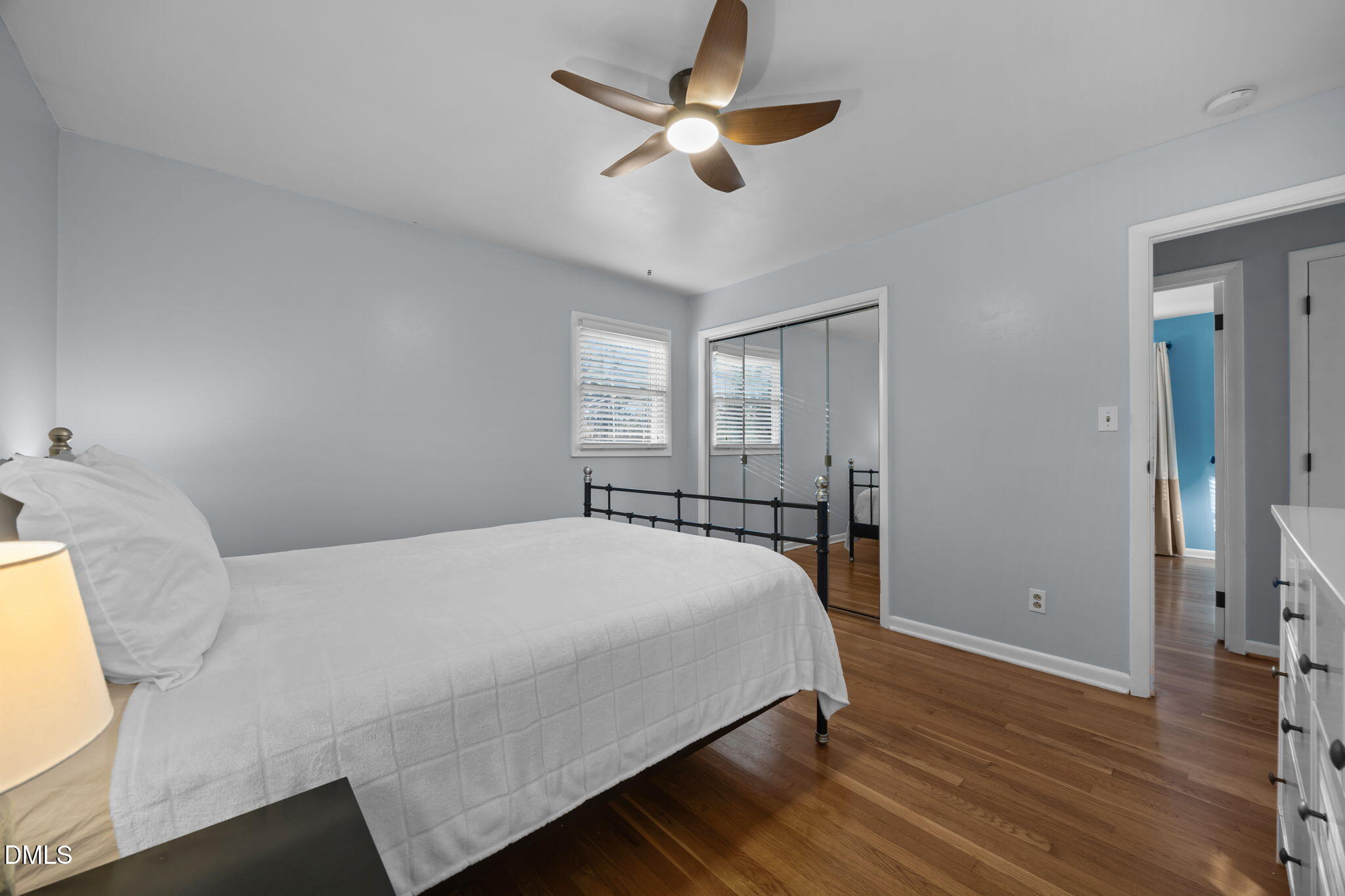 4828 Latimer Road Raleigh, NC 27609 - Photo 16 of 47 a bedroom with a bed and a chandelier