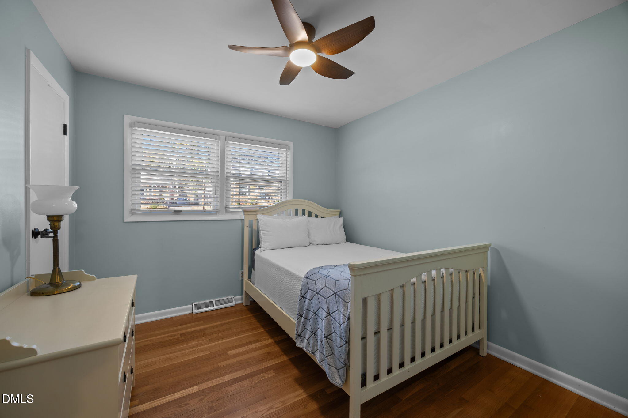 4828 Latimer Road Raleigh, NC 27609 - Photo 18 of 47 a bedroom with a bed and a table