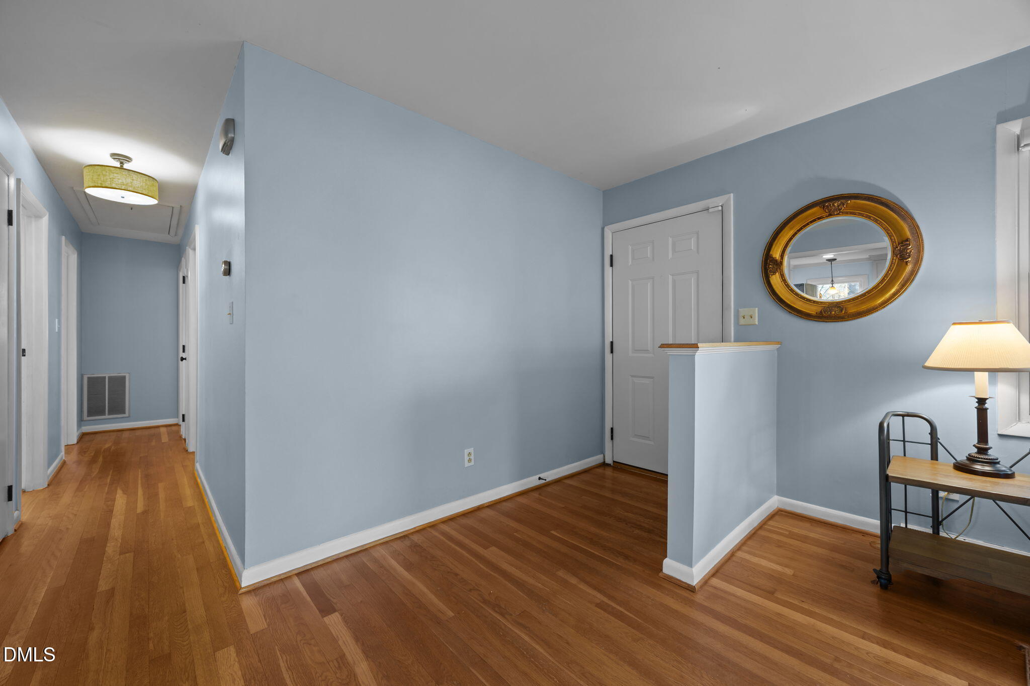 4828 Latimer Road Raleigh, NC 27609 - Photo 21 of 47 a view of a hallway to a house and wooden floor